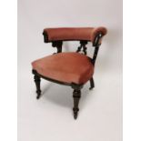 19th C. mahogany and upholstered arm chair on turned legs and brass castors {75 cm H x 57 cm W x 70