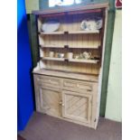 Late 19th. C. painted pine cottage dresser with three shelves over two door originally from Co Meath