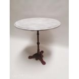 Cast iron garden table with marbleised wooden top {70cm H X 66cm Dia.}.