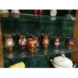 Seven 19th C. lustre jugs.