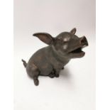 Bronze model of a pig {33 cm H x 32 cm W x 44 cm D}.