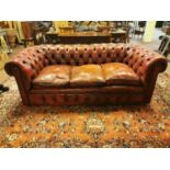 Early 20th C. hand dyed oxblood leather chesterfield sofa {72 cm H x 206 cm W x 90 cm D}.