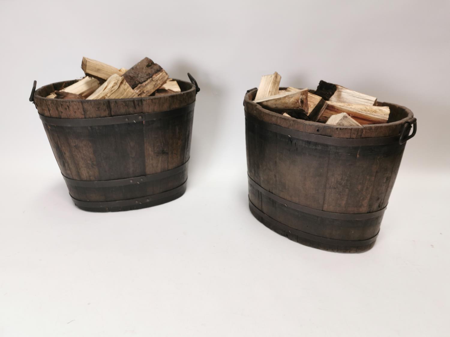 Pair of 19th C. oak metal bound log buckets {49 cm H x 62 cm W x 43 cm D}.