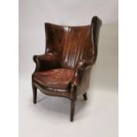 Exceptional quality hand dyed leather barrel backed armchair on mahogany square tapered legs. {112 c
