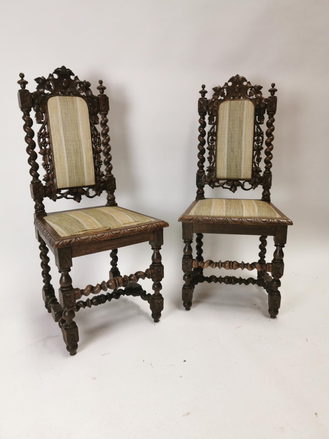 19th. C. upholstered carved oak hall chairs decorated with vines. {108 cm H x 48 cm W x 43 cm D}.