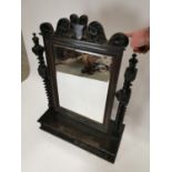 Early 20th carved oak dressing table mirror with two drawers in the frieze raised on barley supports