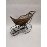 19th C. metal and wicker child's pram {85cm H x 114 cm W x 52 cm D}.