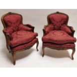Pair of Edwardian walnut and upholstered armchairs.