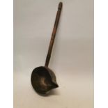 Early 20th C. copper laddle with wooden handle {11 cm H x 66 cm W x 24 cm D}.