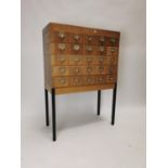 Mid Century bank of wooden index drawers with original chrome handles on metal base {123 cm H x 86 c
