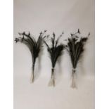 Large collection of peacock feathers.