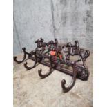 Cast iron coat hanger decorated with race horses. {22 cm H x 39 cm L}