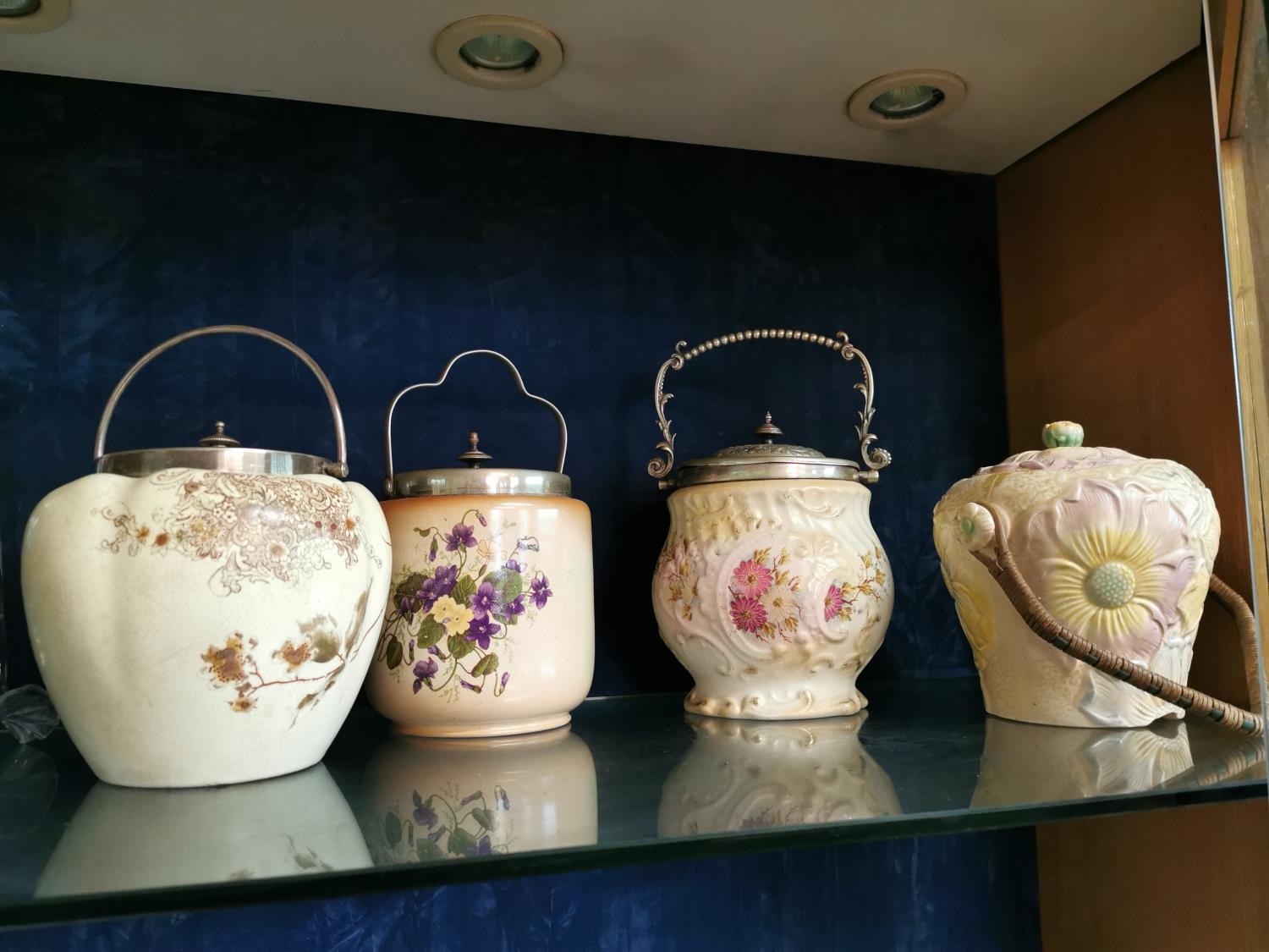 Collection of four vintage ceramic and sivler plated biscuit barrells.