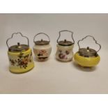 Collection of four vintage ceramic and sivler plated biscuit barrels.