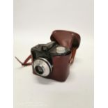 1960's Clack camera in original leather case. { 10cm H X 12cm W X 10cm D }.
