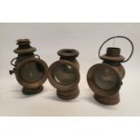Early 19th. C. near pair of brass car lamps and one other.