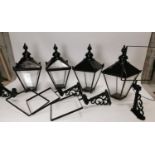 Set of four painted brass lanterns with wall brackets. {82 cm H x 43 cm W x 82 cm D}.