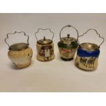 Collection of four vintage ceramic and silver plated biscuit barrells.
