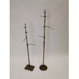 Two early 20th C. brass haberdashery shop hat stands {132 cm H and 104 cm H}.