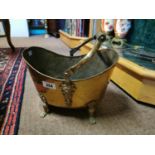 19th. C. brass coal bucket on brass feet with wooden handle {26 cm h}.