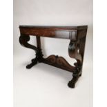 William IV mahogany side table with marble top on two supports decorated with acanthus leaf on lions