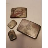 Two silver cigarette boxes and two silver match boxes.