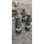 Four cast iron lamp bases and lamp parts. {70 cm H x 25 cm W x 27cm D}.