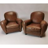 Pair of exceptional quality leather armchairs in the Art Deco style {84 cm H x 90 cm W x 94 cm D}.