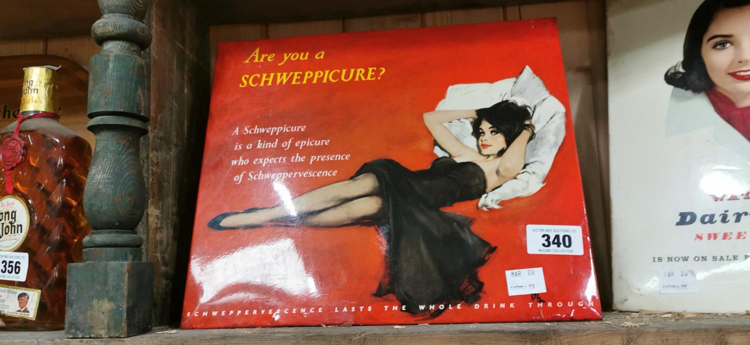 Schweppes Cure advertising sign.