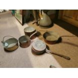 Collection of four copper and brass saucepans