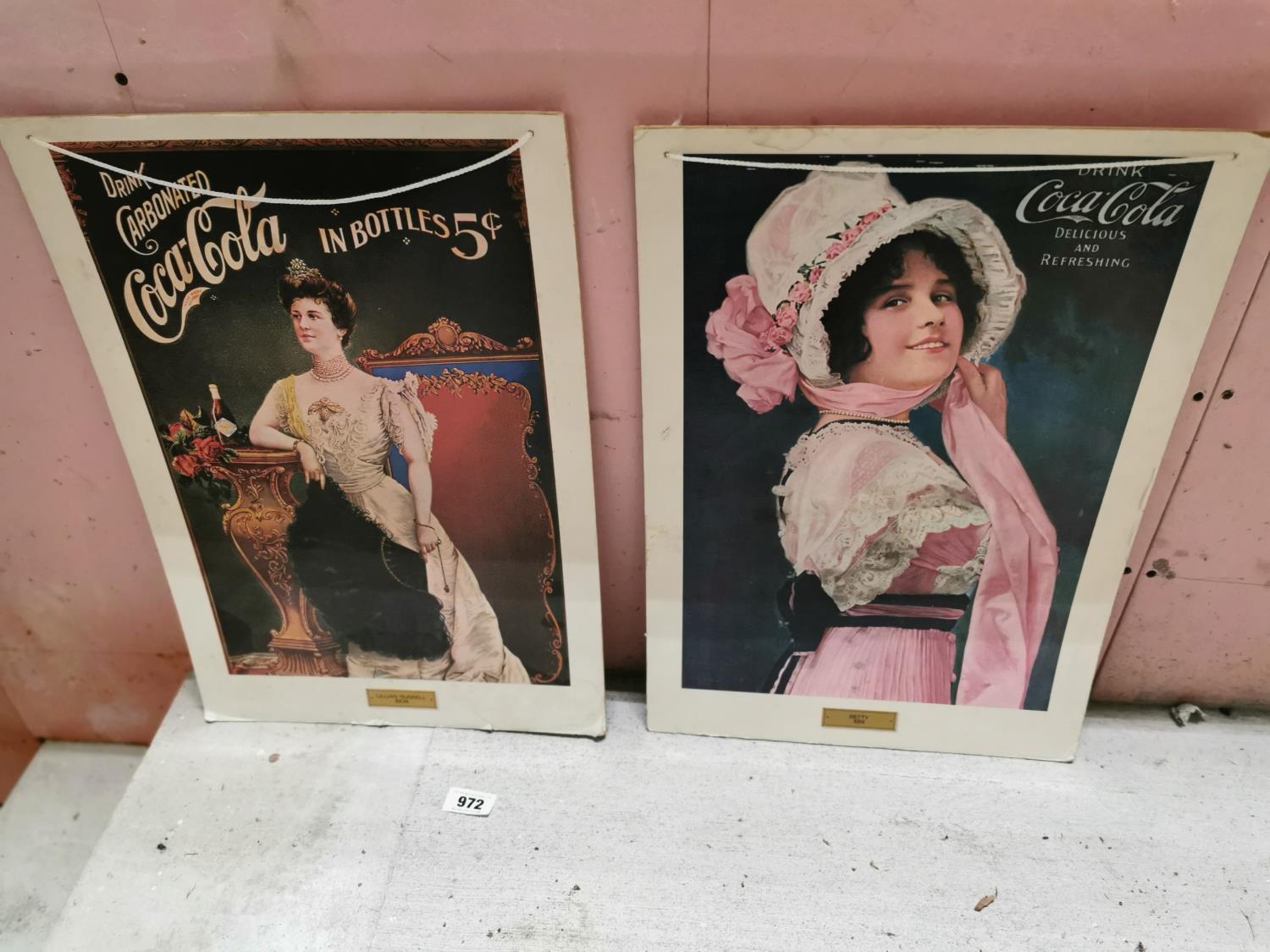 Two Coco Cola advertisements.