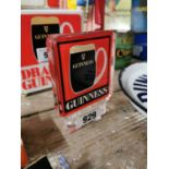 Guinness car badge.