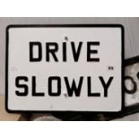 Drive Slowly alloy road sign.