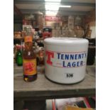Tennent's Lager Ice bucket and bottle of Tennent's Lager.