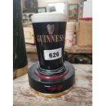 Guinness counter light up advertisement.