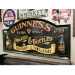 Guinness Extra Stout wooden advertising sign.