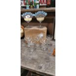 Collection of seven Babycham glasses and two advertisements.