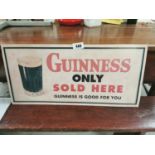 Guinness Sold Here Only advertisement.