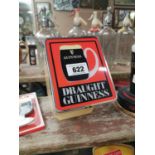 Draught Guinness counter light up advertisement.