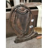 Bronzed plaque with harp Eire.