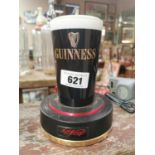 Guinness counter light up advertisement.