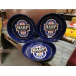 Set of three Harp Lager advertising drinks trays.