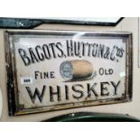 Bagot's Hutton & Co's Irish Whiskey advertising sign.