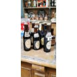 Seven sealed bottles of Guinness.