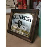 Guinness Extra Stout advertising mirror.