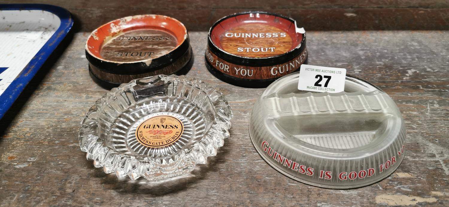 Four Guinness advertising ashtrays.