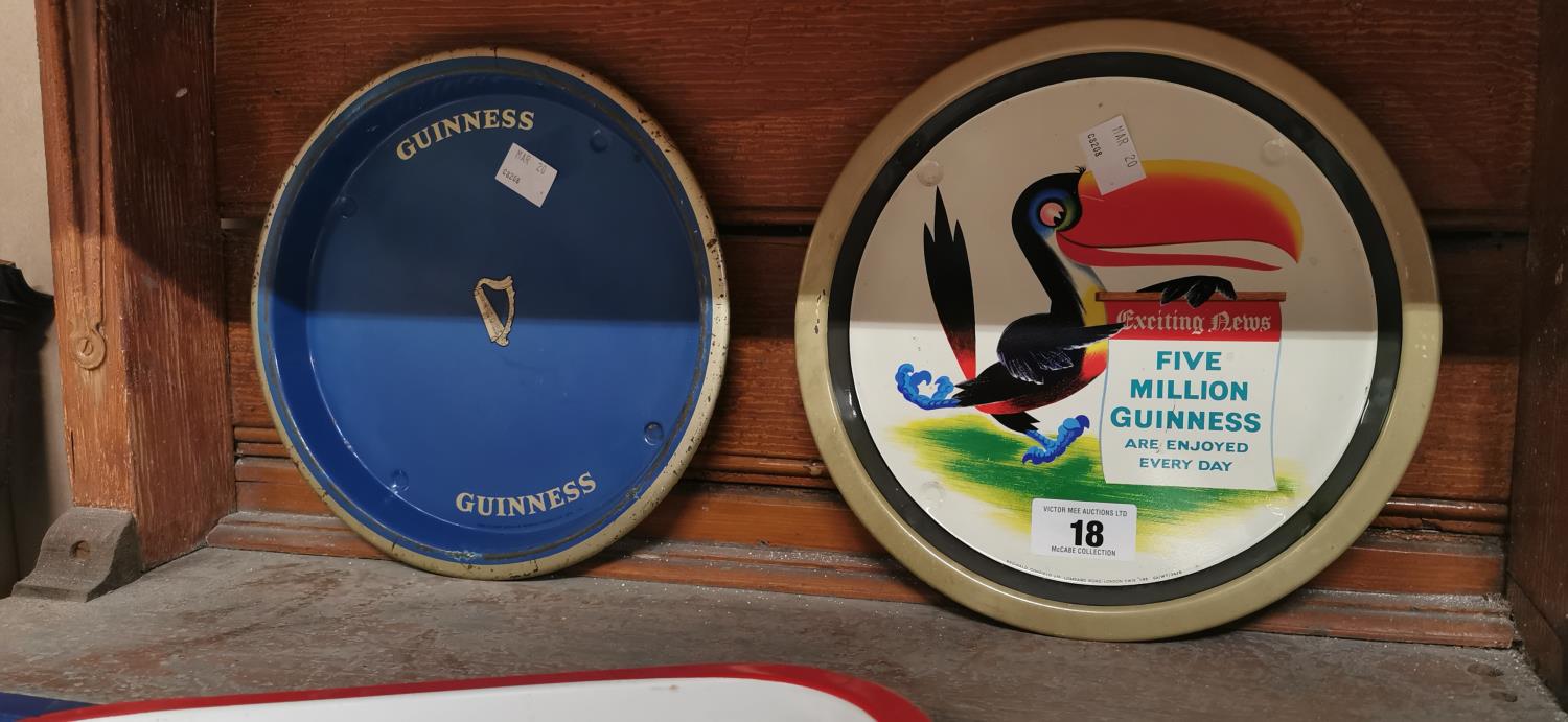 Two Guinness advertising trays.