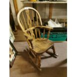 Elm Windsor child's rocking chair.