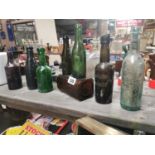 Eight misc. old beer and mineral bottles.