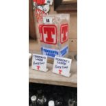 Three Tennent's Lager shelf advertisements.